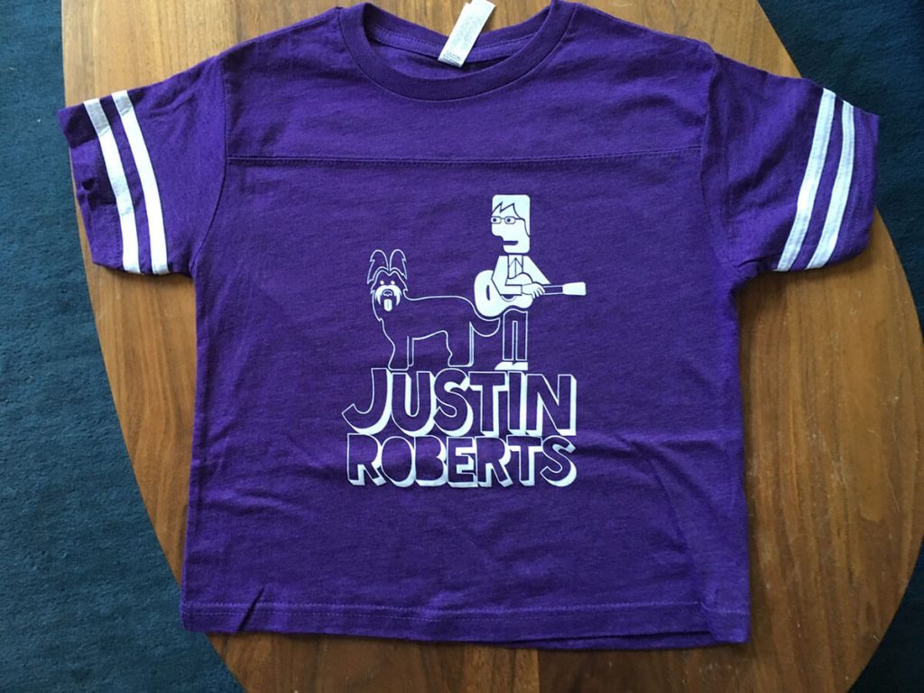 children's purple football jerseys with Justin Roberts and his dog Mona printed in white